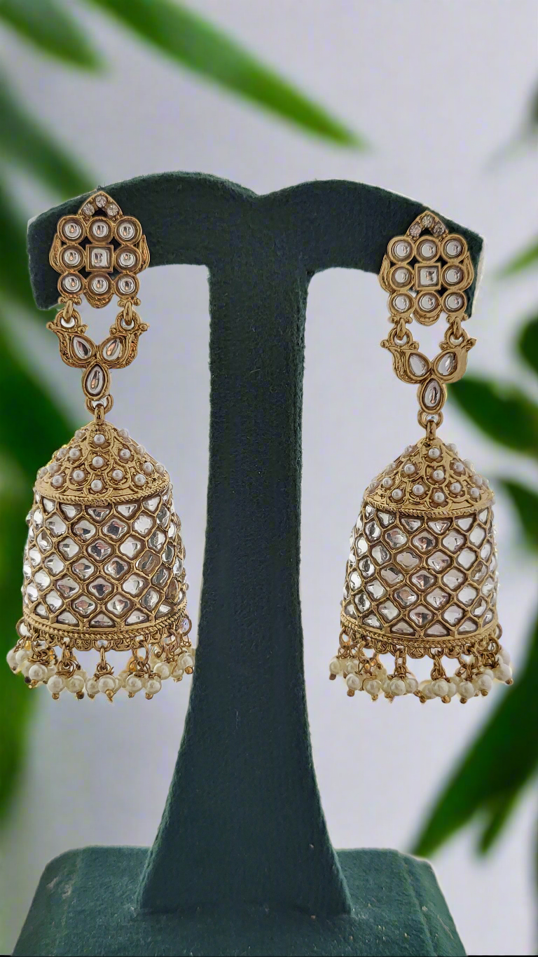Antique gold polki stone jhumkas.