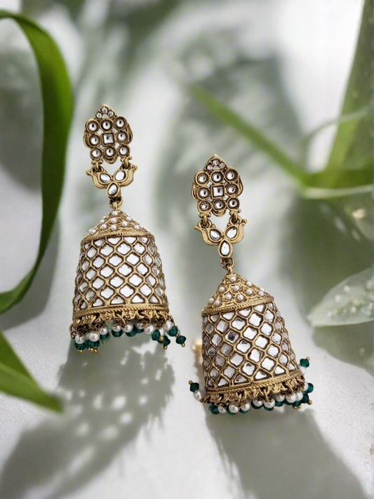 Antique gold polki stone jhumkas.