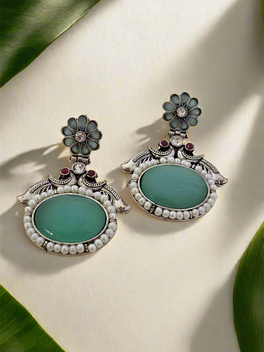 Oxidized Peacock motif earrings with big center stone