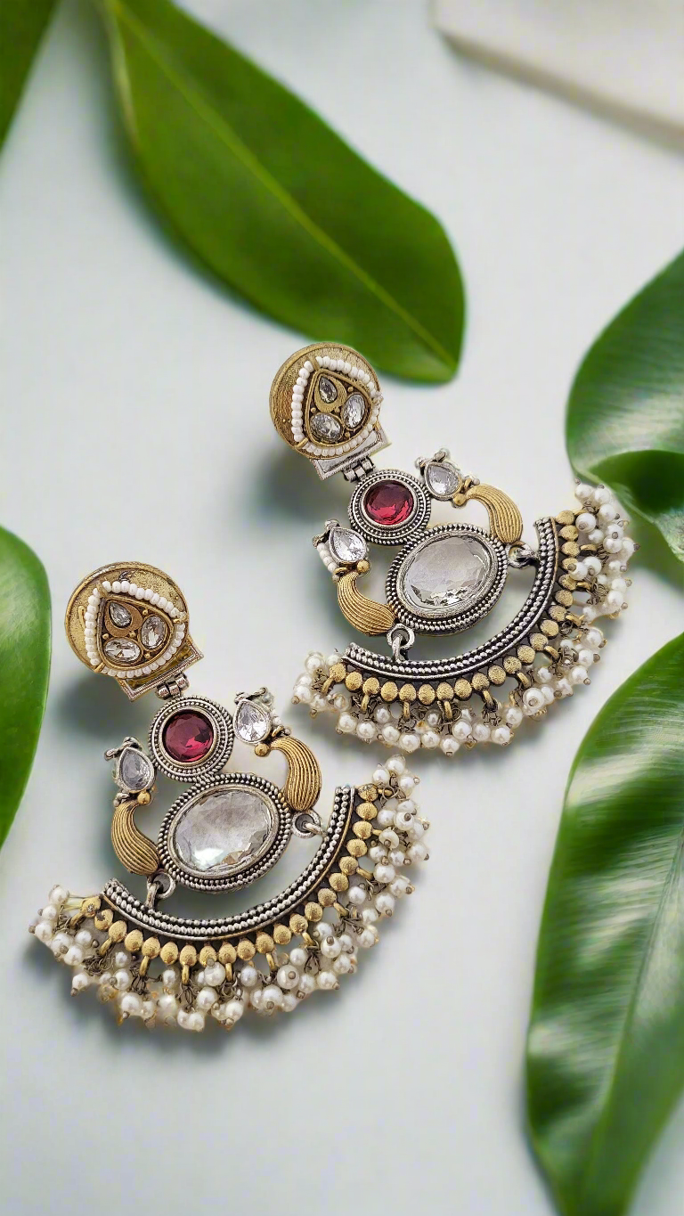 Two tone earrings with stone and pearl