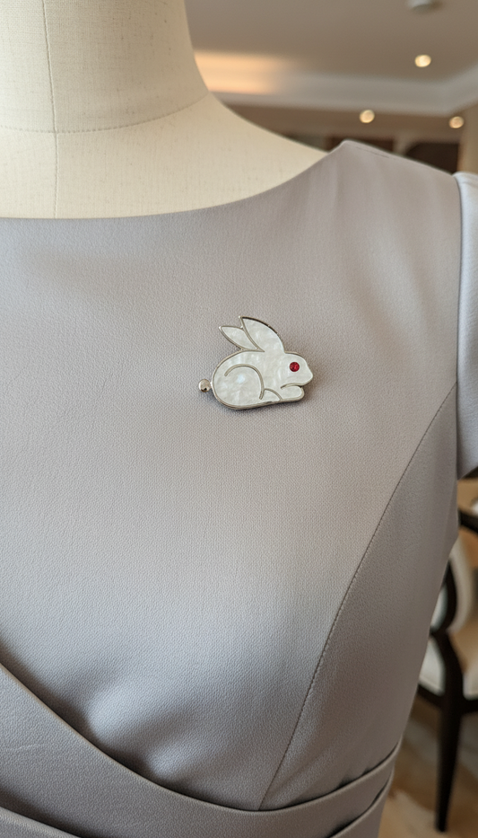 Sleek White Enamel Rabbit Pin with Ruby Eye